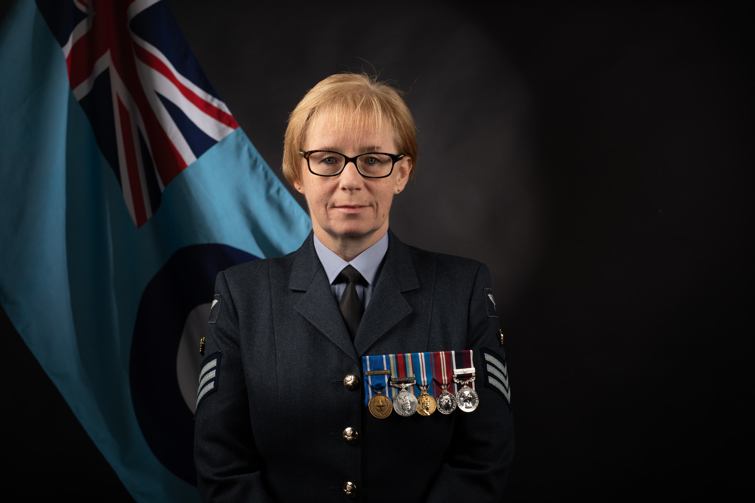 Image shows aviator official portrait with RAF Flag.